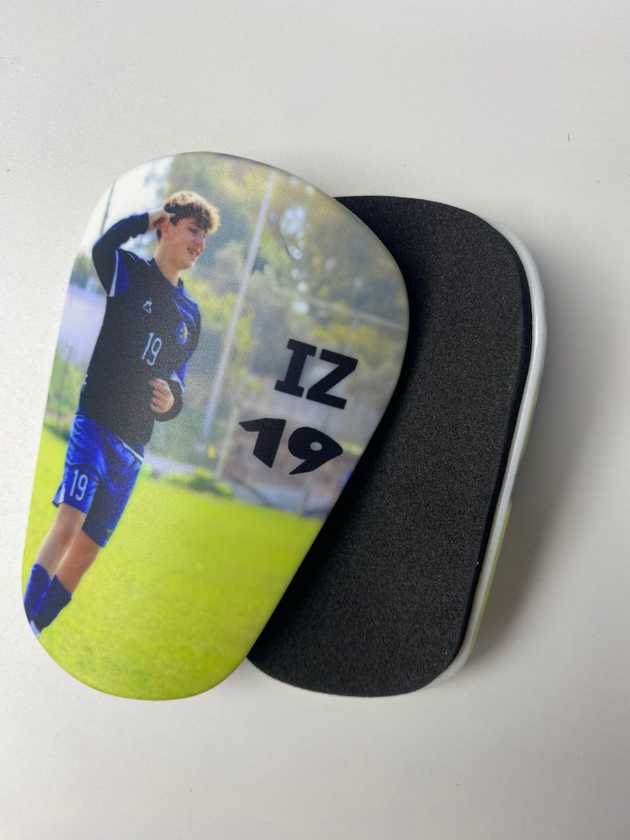 Custom shin guards with a young player photo and IZ 19