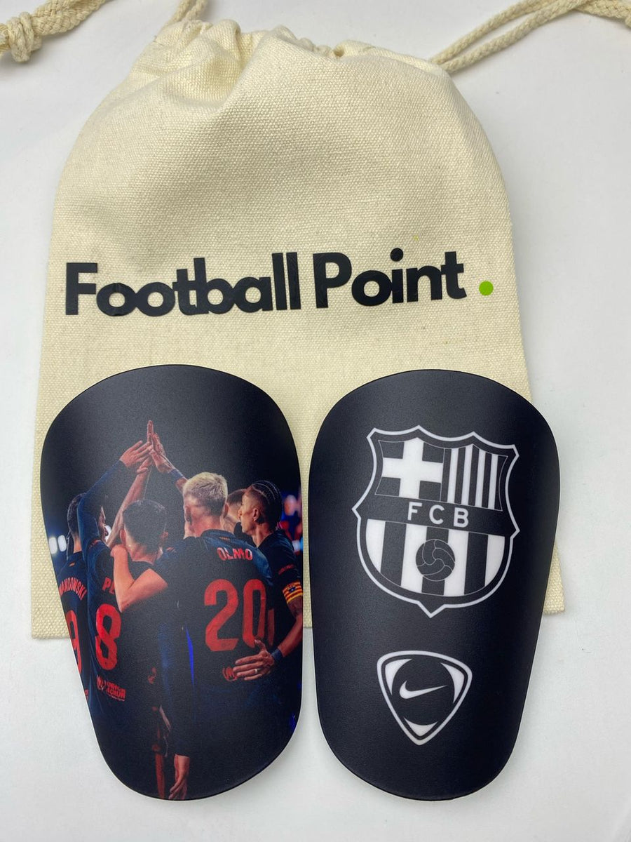 Custom shin guards with a Barcelona celebration photo and FCB crest