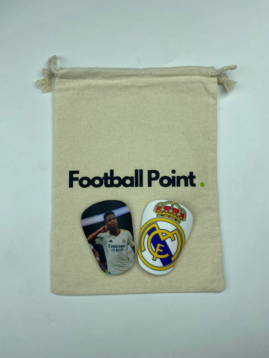 Custom shin guards with a Real Madrid player photo and club crest