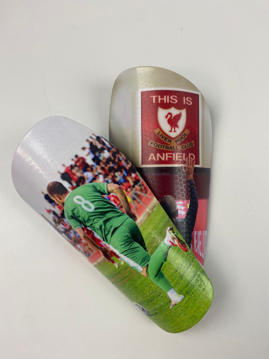 Custom shin guards with a number 8 action photo and Anfield design