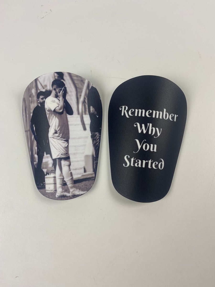 Custom shin guards with a black-and-white player photo and Remember Why You Started